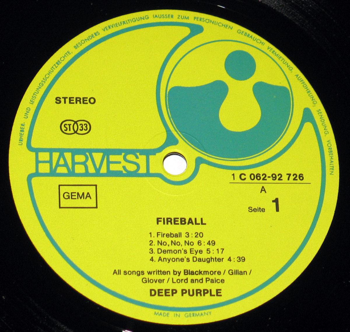 Yellow and green record label of Deep Purple’s Fireball vinyl LP, pressed in Germany by Harvest Records. Features the Harvest logo, catalog number 1C 062-92 726, “Stereo” and “ST 33” format indicators, GEMA logo, and song credits to Blackmore, Gillan, Glover, Lord, and Paice. Includes “Made in Germany” text at the bottom and German copyright details around the outer edge